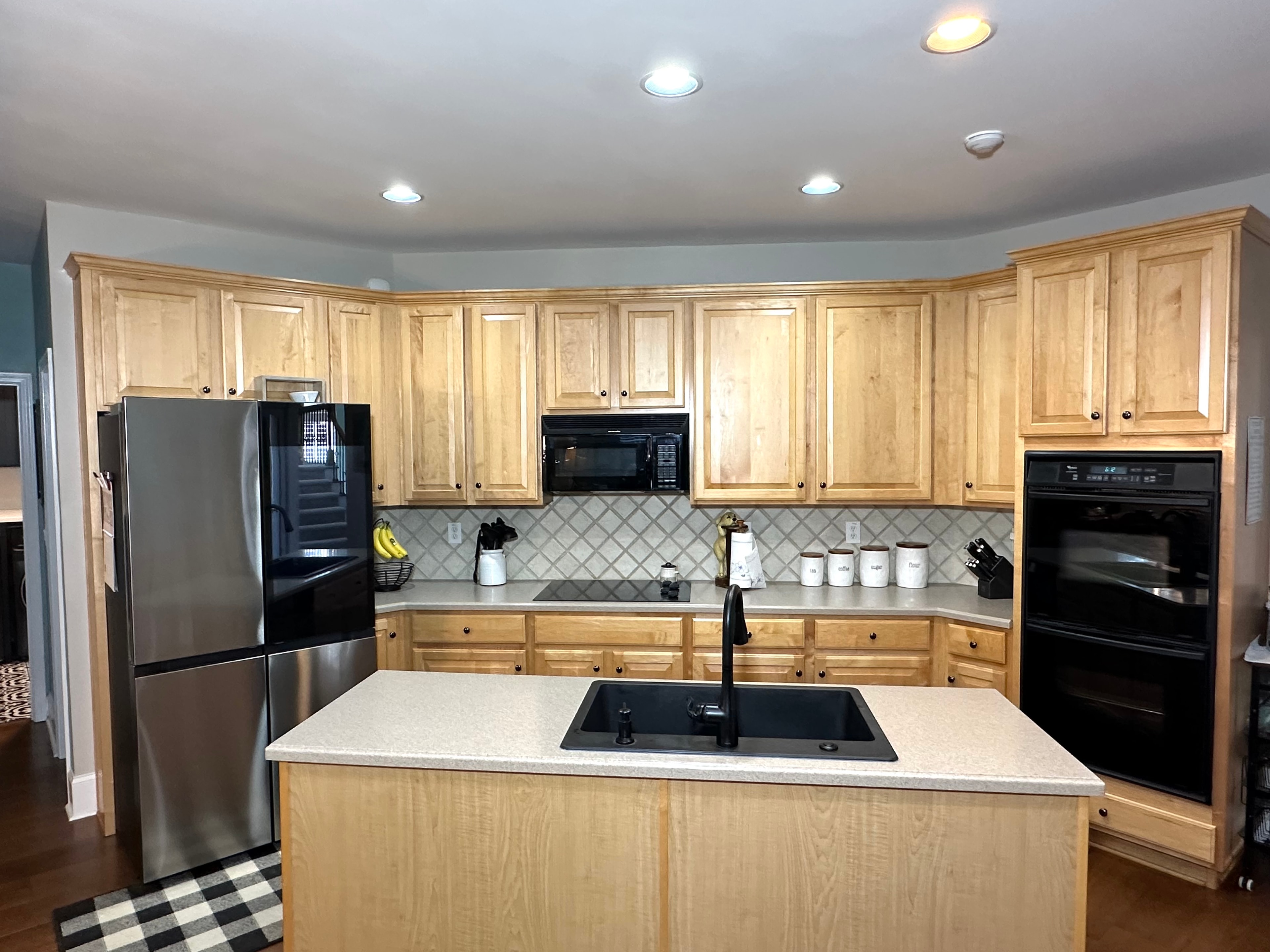 Modern kitchen with white cabinets and granite countertops